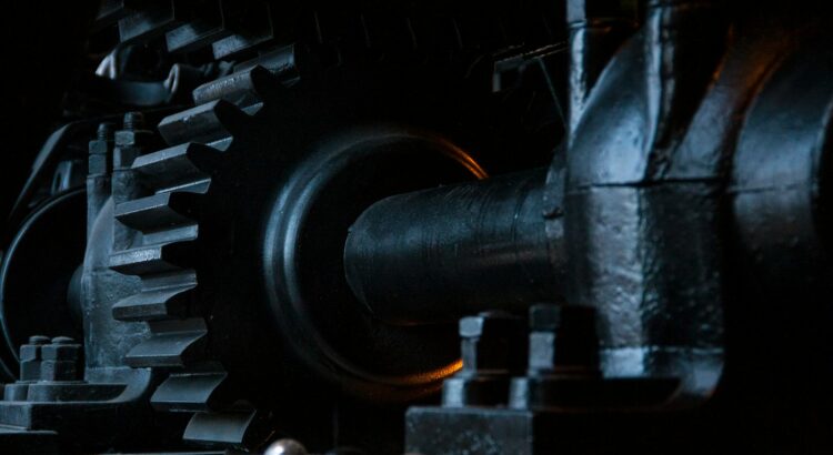 close-up photography of black metal gears